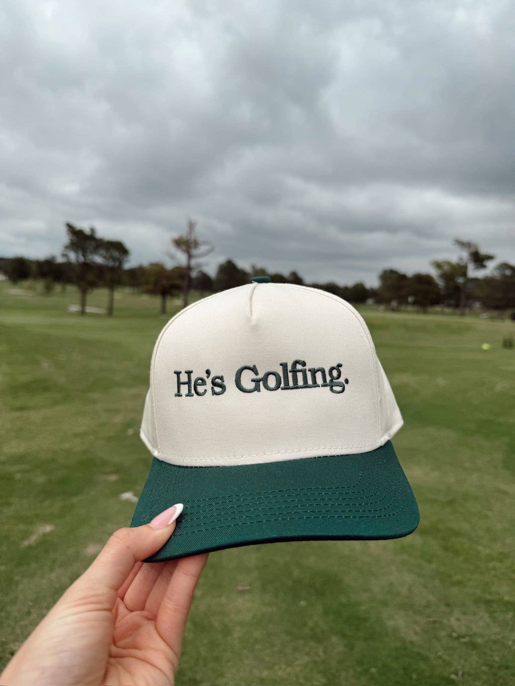 He's Golfing - Trucker Hat
