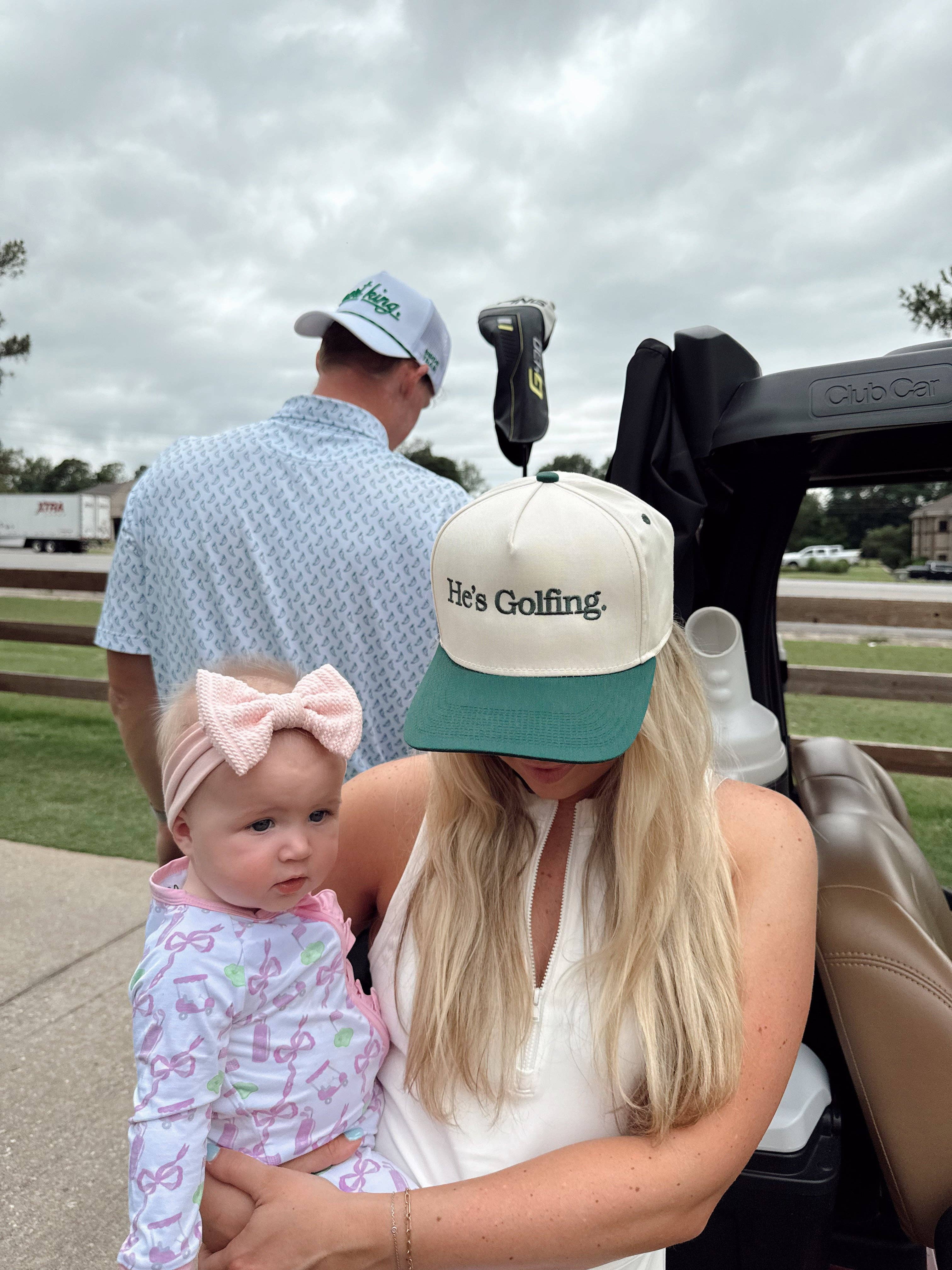 He's Golfing - Trucker Hat